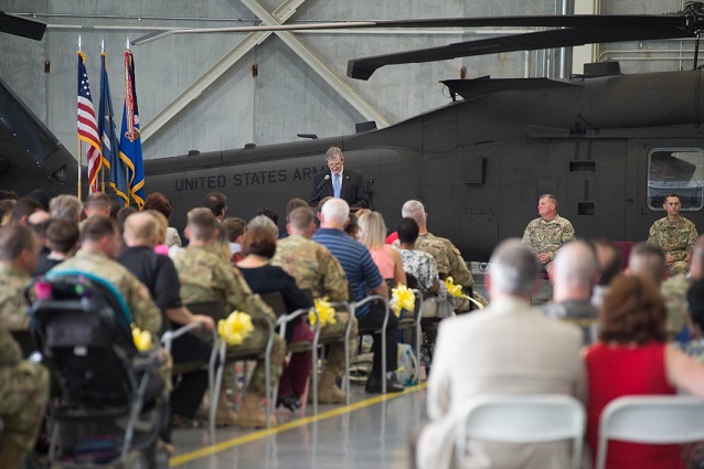 Louisiana State Senator John Kennedy addresses Soldiers of the 1st Assault Helicopter Battalion, 244th Aviation Regiment, and their families during a deployment ceremony at the Army Aviation Support Facility #1 in Hammond, Louisiana, Oct. 6, 2017. The Hammond-based unit deployed to Kuwait and other locations in the region to provide aerial medical evacuation and equipment and personnel transport in support of Operations Spartan Shield and Inherent Resolve. (U.S. Army National Guard photo by Staff Sgt. Josiah Pugh)