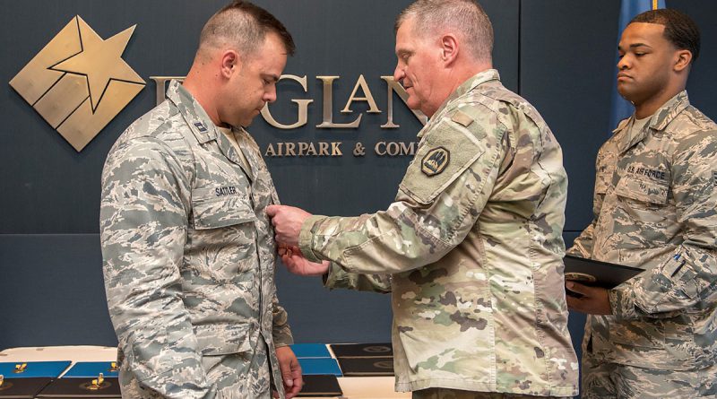 Maj. Gen. Glenn H. Curtis, adjutant general of the Louisiana National Guard, awards Capt. Alex Sattler, 259th Air Traffic Control Squadron, Louisiana Air National Guard, the Bronze Star Medal during the 259th award ceremony at the England Air Park Terminal in Alexandria, Louisiana, April 15, 2018. Sattler was one of 16 Airmen from the LAANG honored for their deployment to Iraq in support of Operation Inherent Resolve. (U.S. Air National Guard photo by Senior Airman Cindy Au)