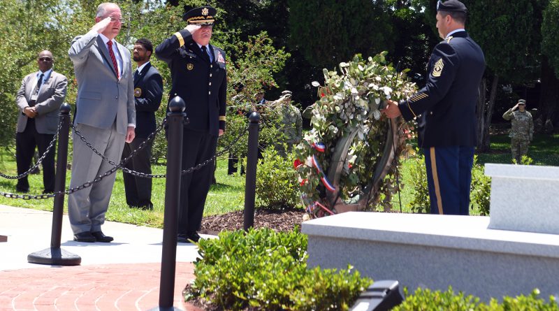 Louisiana Gov. John Bel Edwards and Maj. Gen. Glenn H. Curtis, adjutant general of the Louisiana National Guard, render a salute as Taps is played during an official ceremony memorializing a new monument honoring fallen Louisiana Guardsmen at Louisiana Veterans Memorial Park in Baton Rouge, Louisiana, May 21, 2019. (U.S. Air Force National Guard photo by Master Sgt. Toby Valadie)
