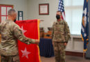 Maj. Gen. Lee Hopkins, assistant adjutant general of the Louisiana National Guard, watches as Command Sgt. Maj. Clifford Ockman, senior enlisted leader of the LANG, unfurls and presents the two-star general officer flag during his promotion ceremony at the Armed Forces Reserve Center in Baton Rouge, Louisiana, Aug. 20, 2021. Hopkins, who has served in the Army for 37 years, is currently the principal military advisor to the adjutant general of the LANG, and is responsible for assisting in the deployment and coordination of programs, policies, and plans for the Louisiana Army and Air National Guard. (U.S. Army National Guard photo by Sgt. 1st Class Denis B. Ricou)